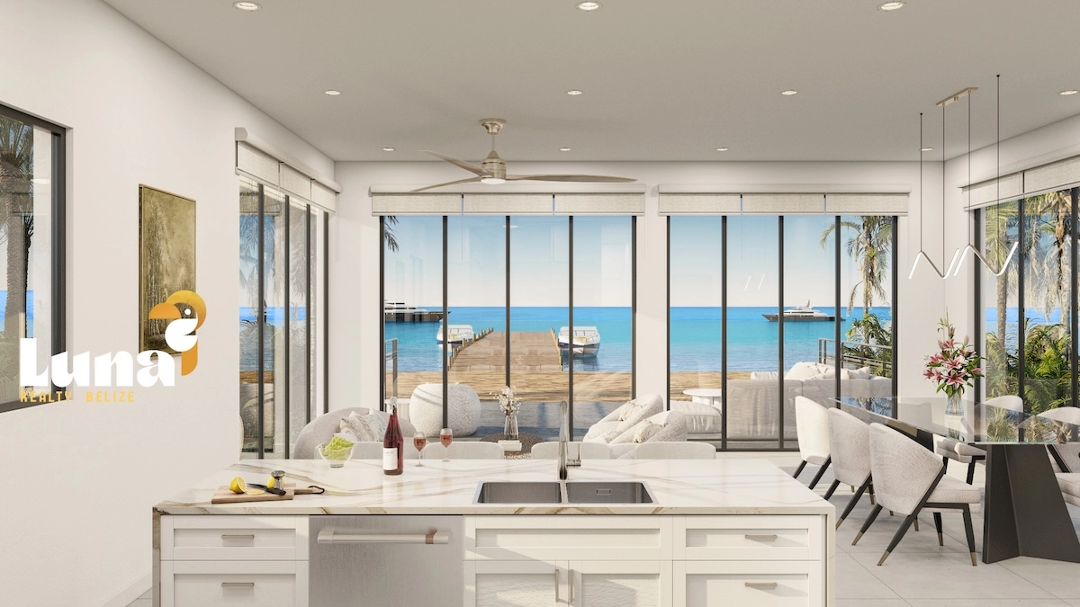 Modern kitchen with ocean view and patio.