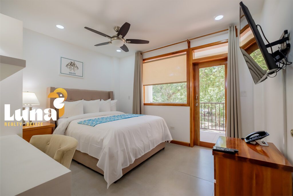 Modern bedroom with balcony and minimalist decor.