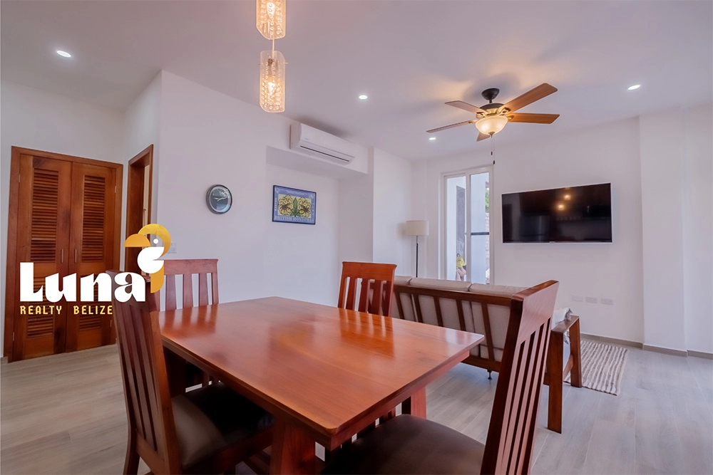 Dining and living area with modern furnishings.