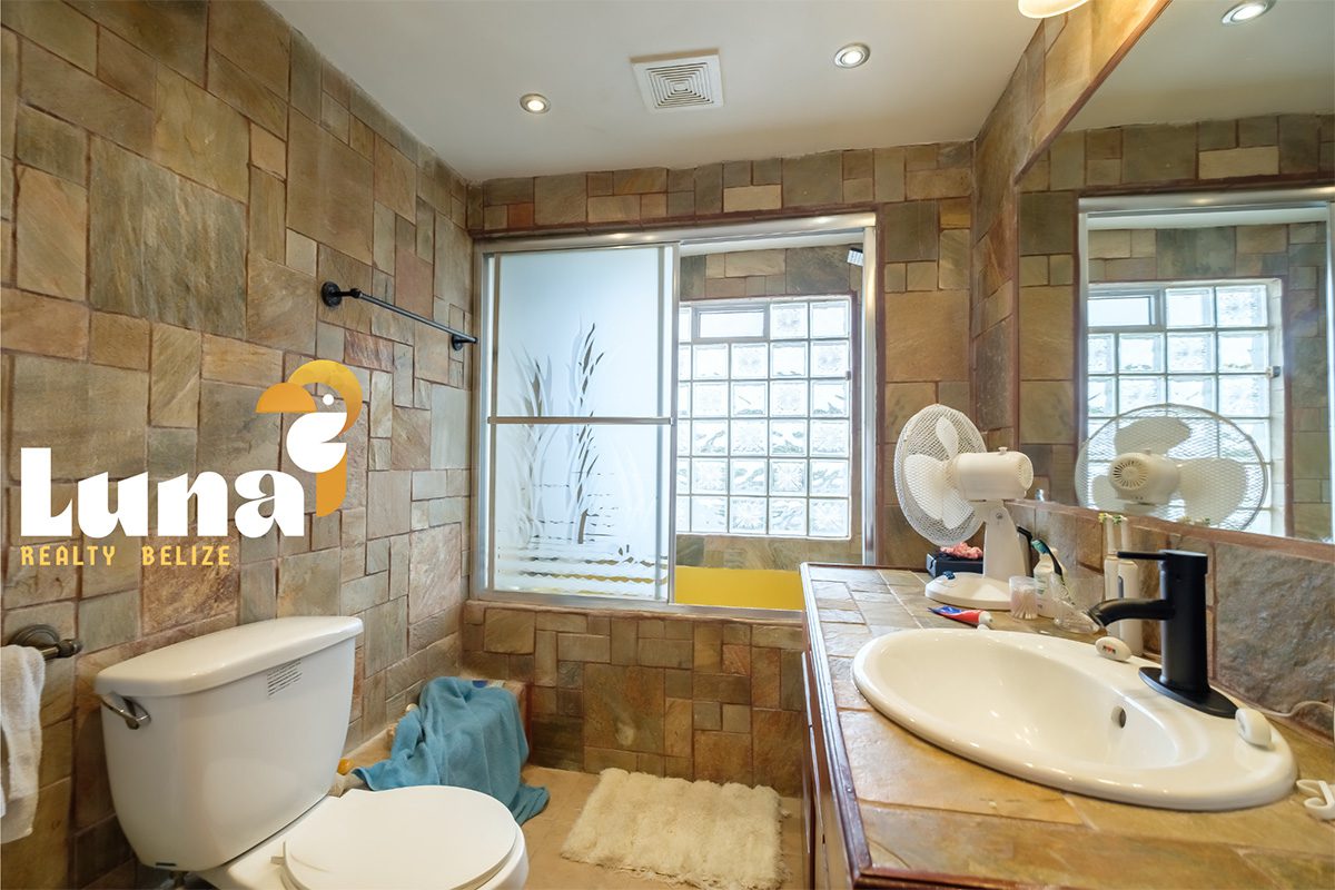 Rustic bathroom with stone tile design.