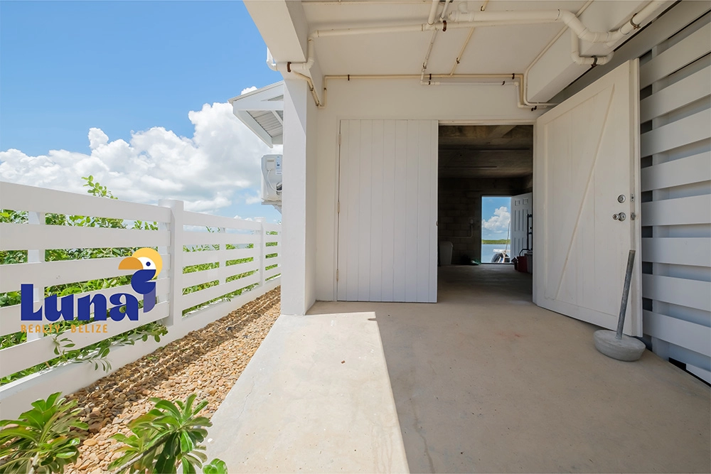 Outdoor entrance with white sliding doors.
