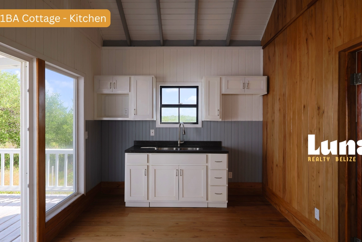Small kitchen with wooden and white decor.