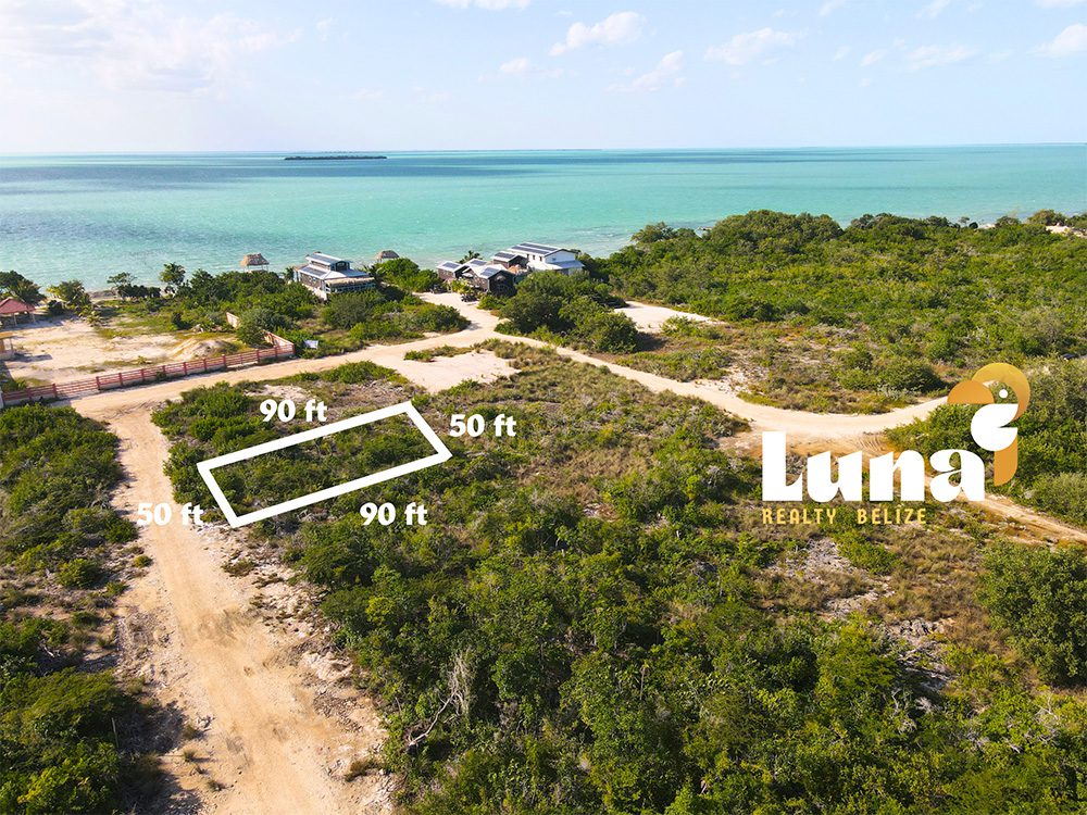 Coastal land plot with dimensions and sea view.