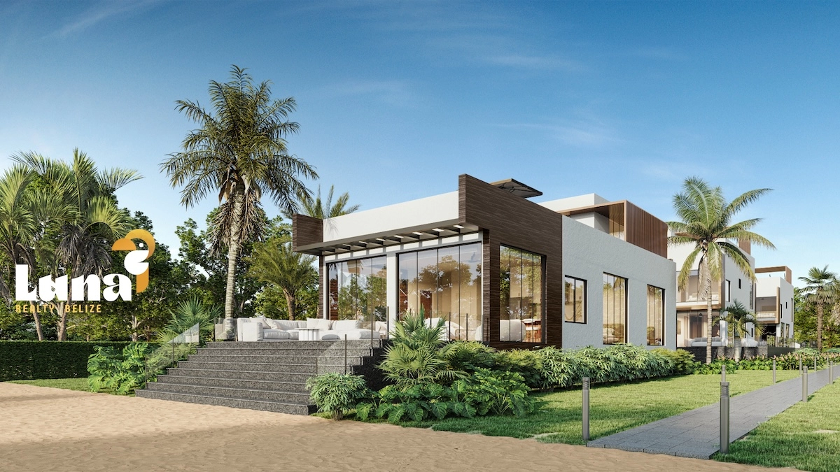Modern house with palm trees and lawn.