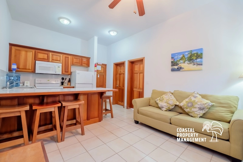 Cozy kitchen and living area with sofa.