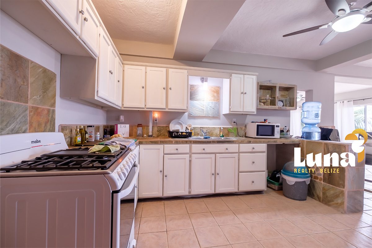 Spacious kitchen with modern appliances and cabinets.