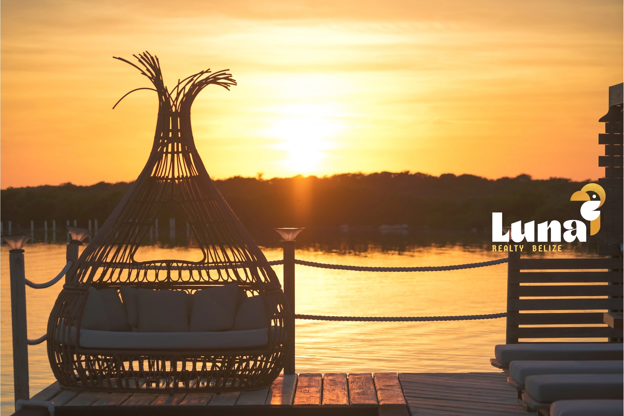 Sunset view with wicker chair on dock.