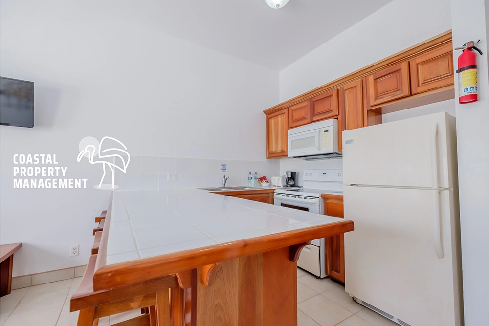 Modern kitchen with wooden cabinets and island.