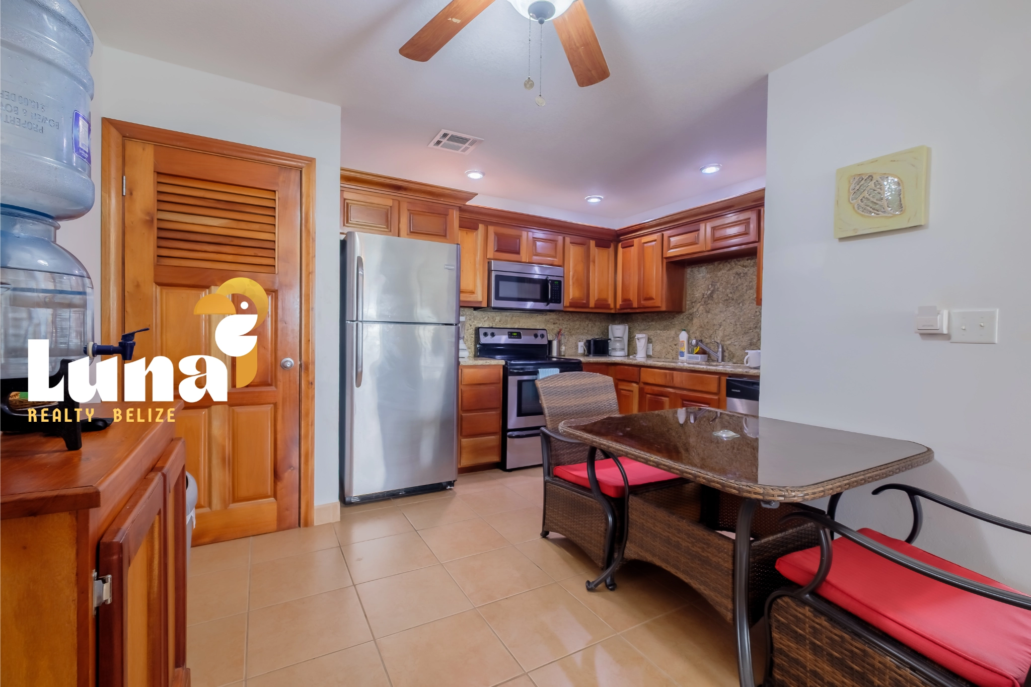 Modern kitchen with wooden cabinets and table.
