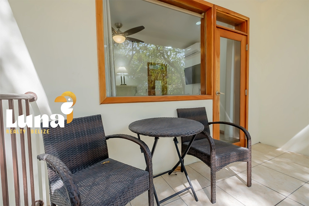 Outdoor patio with table and chairs.