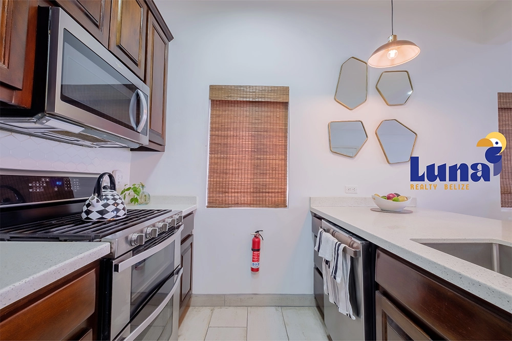 Modern kitchen with stainless steel appliances.