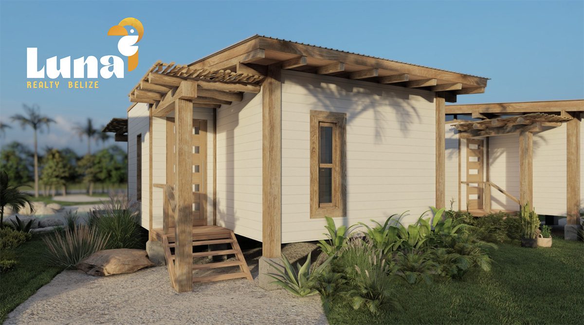 Small wooden house with tropical landscaping.