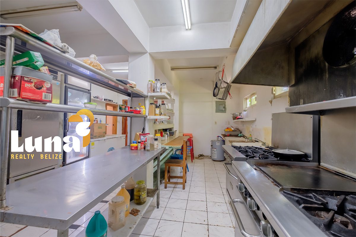 Commercial kitchen with stainless steel appliances.