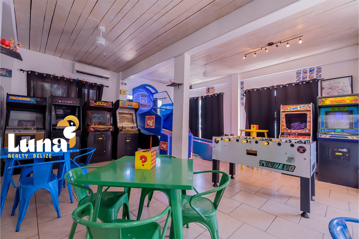 Arcade room with games and tables.