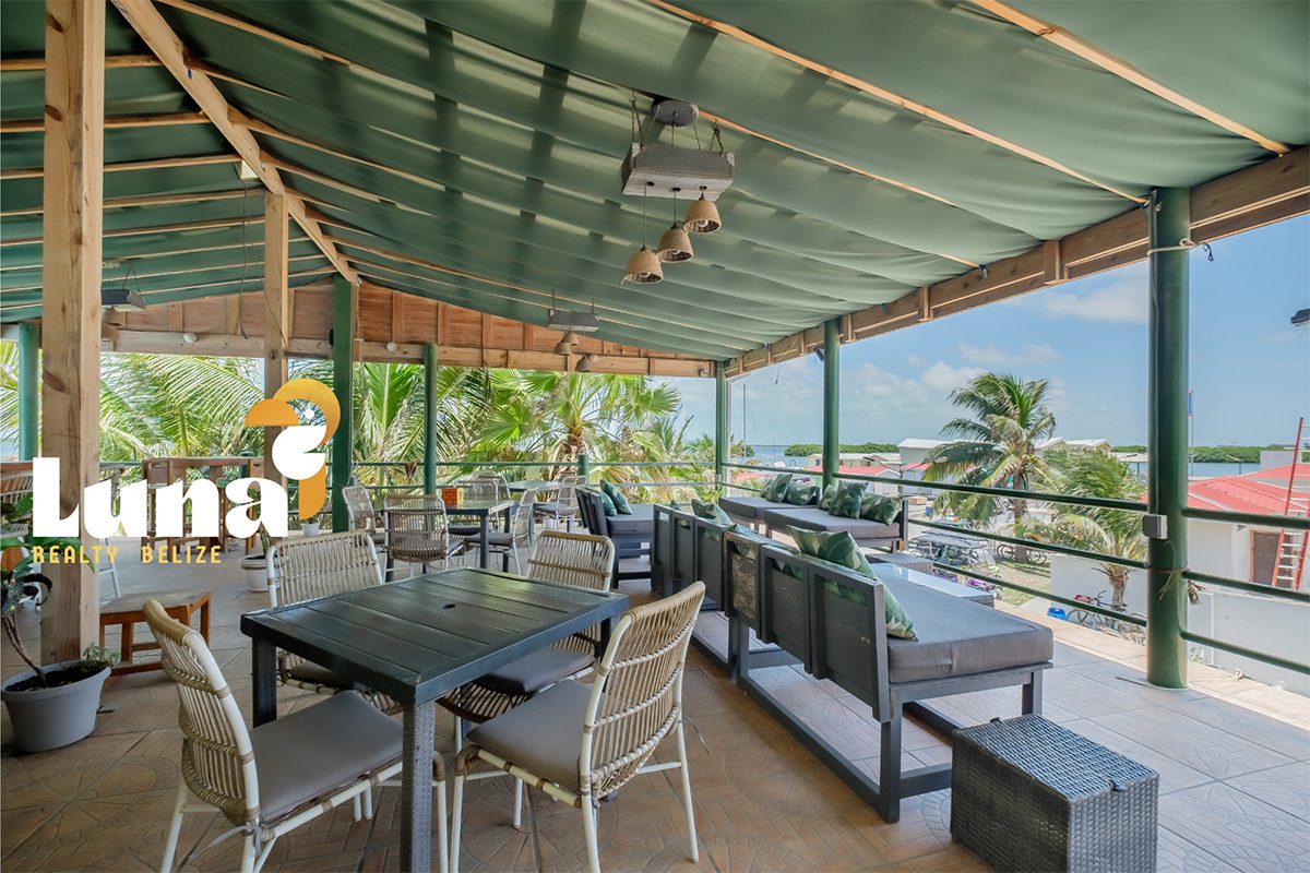 Outdoor patio with seating and ocean view.