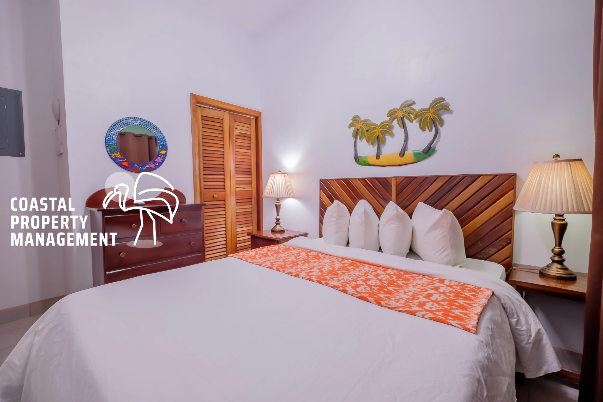 Cozy bedroom with tropical decor elements.