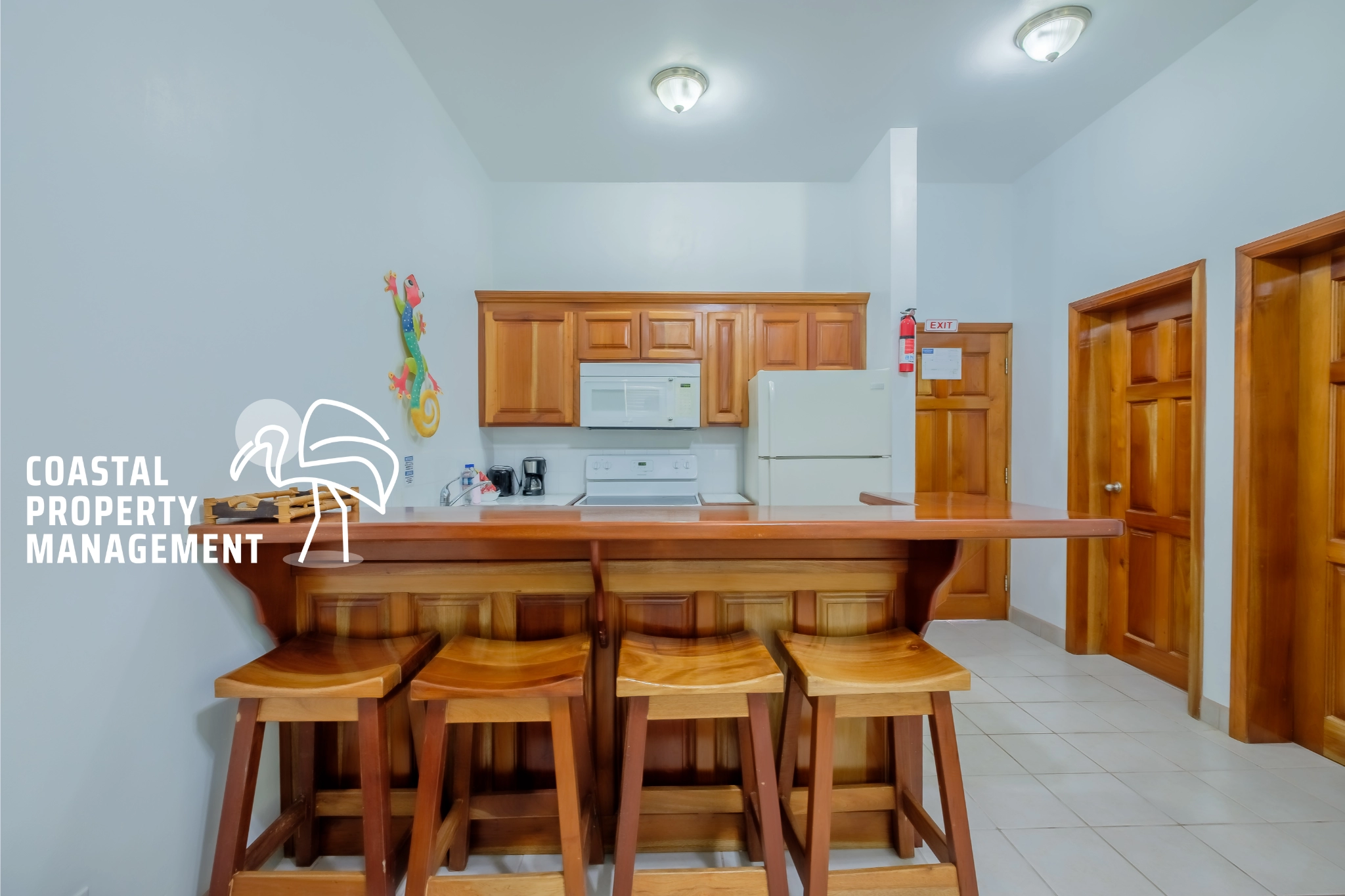 Modern kitchen with wooden bar stools.