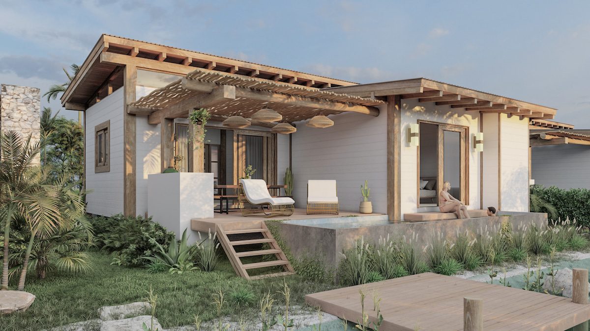 Modern bungalow with wooden deck and chairs.