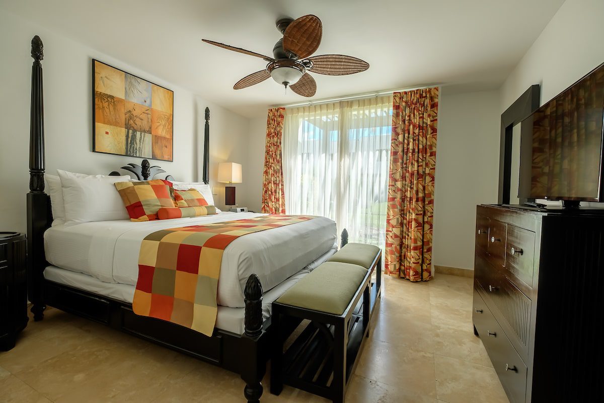 Elegant hotel room with colorful decor.