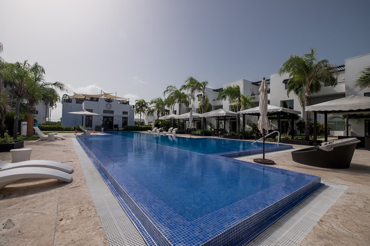 Luxurious resort pool with lounge chairs.