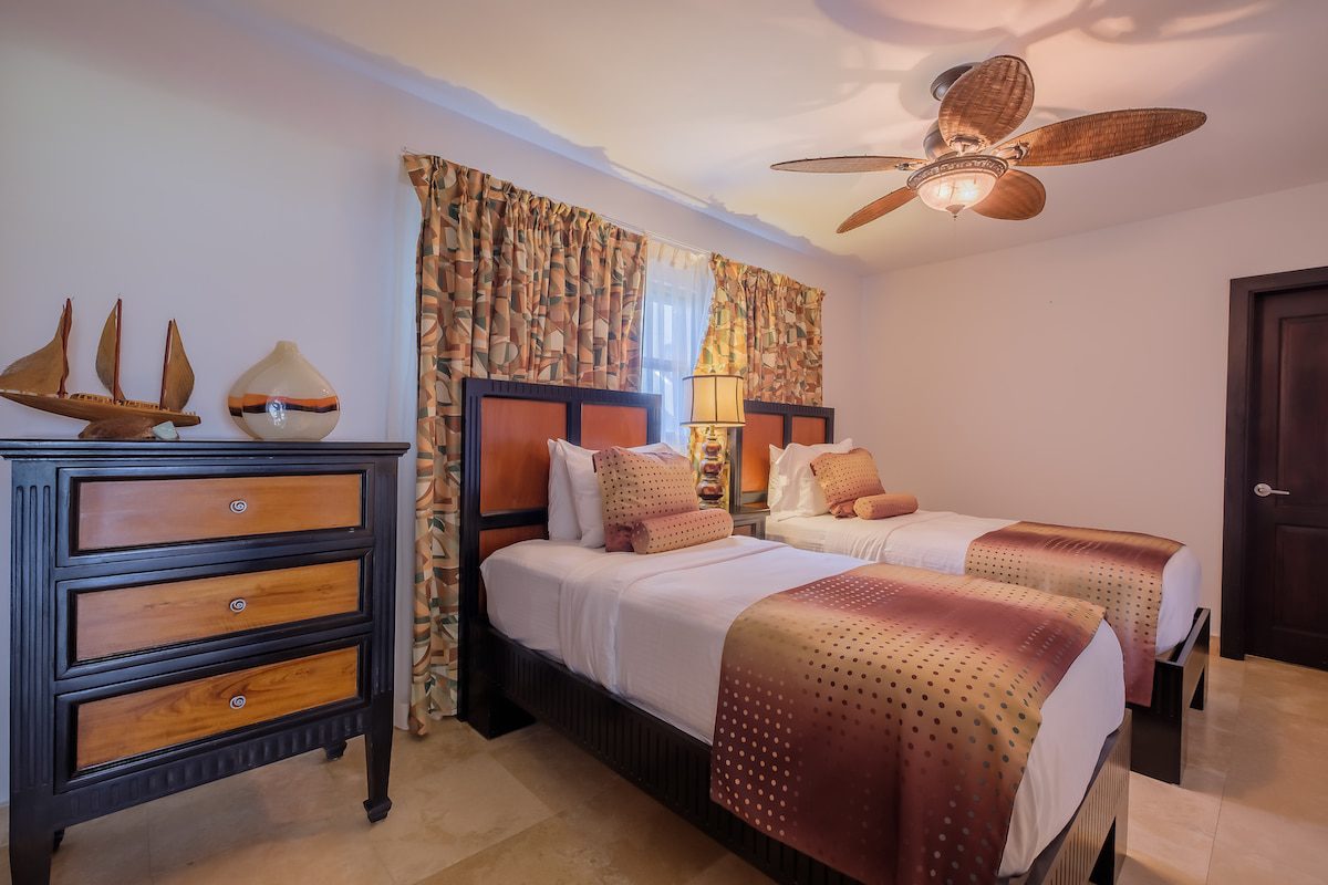 Cozy bedroom with twin beds and decor.
