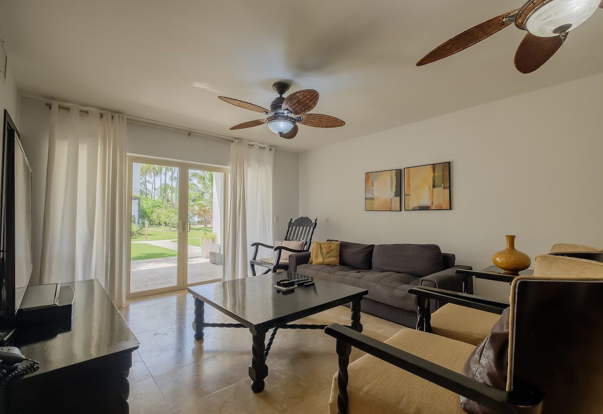 Modern living room with ceiling fans.