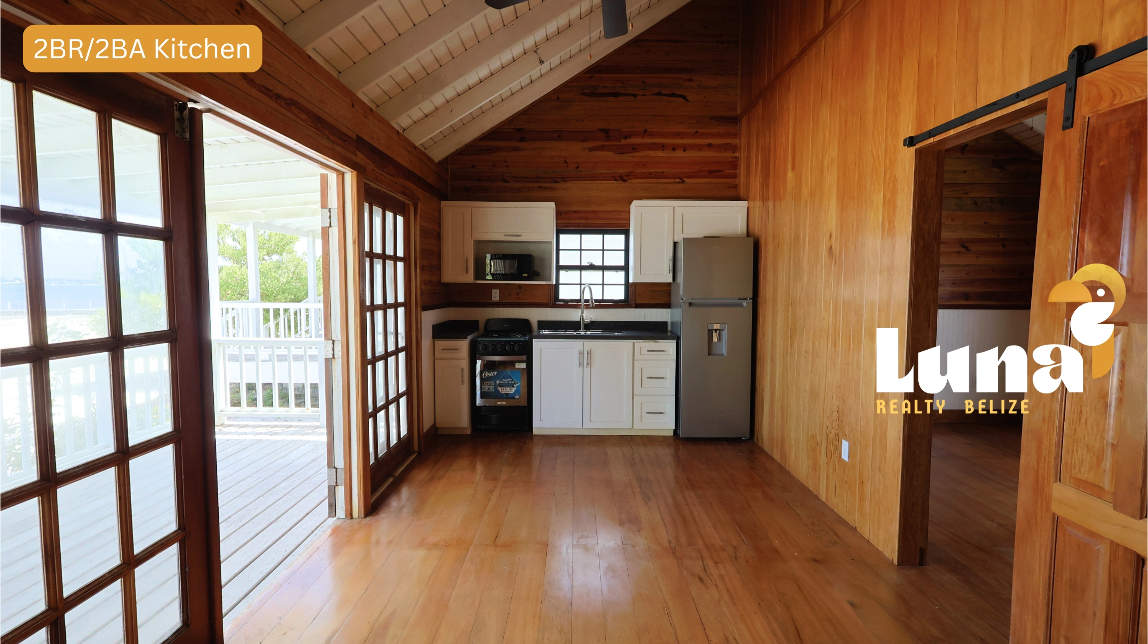 Wooden kitchen with open patio doors.