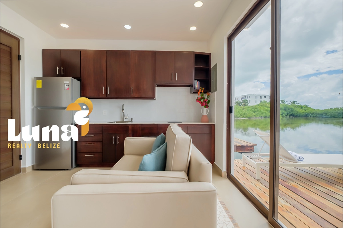 Modern kitchen with lake view and sofa.