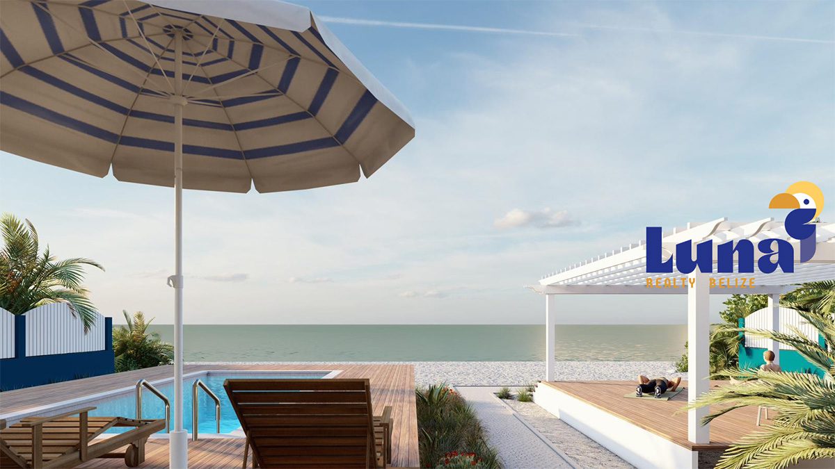 Beachside deck with umbrella and seating.