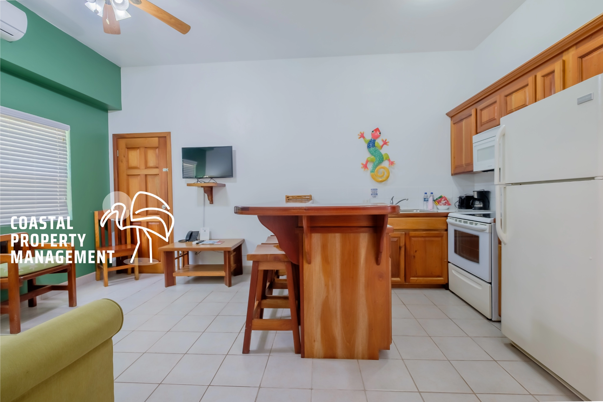 Cozy kitchen with wooden cabinets and island.