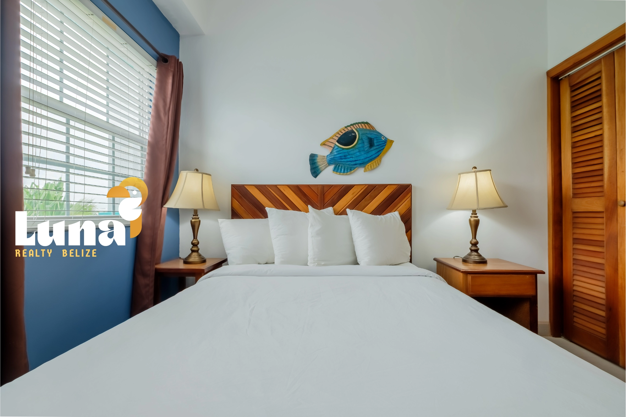 Cozy bedroom with fish wall decor.