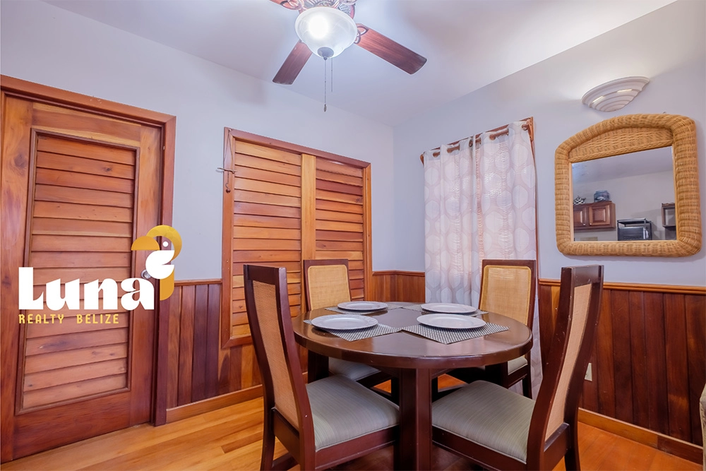 Dining area with wooden furniture and decor.